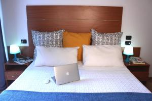A bed or beds in a room at Residence Del Sole