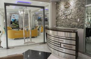 a store with a yellow couch in a room at Samay Business Hotel and Departments in Cusco