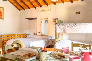 A bed or beds in a room at Agriturismo Pian di Fiume
