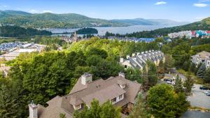 an aerial view of a town with a house at Les Falaises Tremblant - Ski Inout Condo W2bdrs in Mont-Tremblant