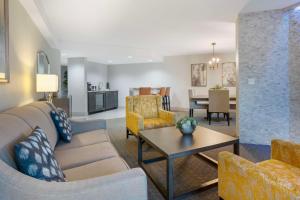 a living room with a couch and a table at Best Western Plus Boomtown Casino Hotel in Reno