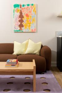 a living room with a couch and a coffee table at YOWIE Hotel in Philadelphia