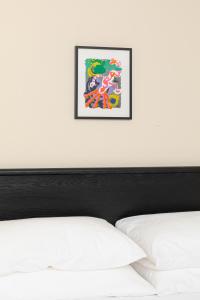 Postel nebo postele na pokoji v ubytování YOWIE Hotel