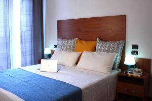 A bed or beds in a room at Residence Del Sole