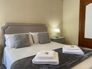Cama o camas de una habitación en Casa de Huéspedes Vecinodecerbantes