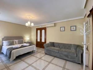 Cama o camas de una habitación en Casa de Huéspedes Vecinodecerbantes