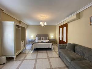 Cama o camas de una habitación en Casa de Huéspedes Vecinodecerbantes
