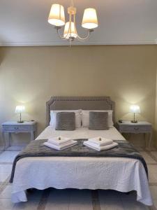 Cama o camas de una habitación en Casa de Huéspedes Vecinodecerbantes