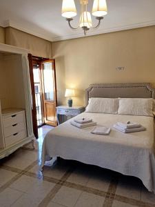 Cama o camas de una habitación en Casa de Huéspedes Vecinodecerbantes