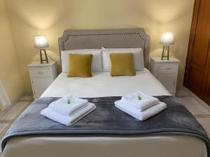 Cama o camas de una habitación en Casa de Huéspedes Vecinodecerbantes
