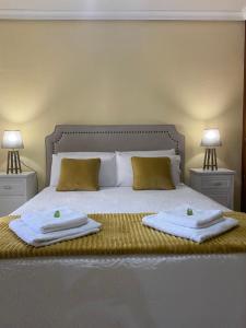 Cama o camas de una habitación en Casa de Huéspedes Vecinodecerbantes
