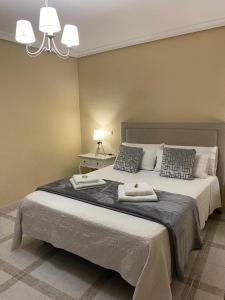 Cama o camas de una habitación en Casa de Huéspedes Vecinodecerbantes