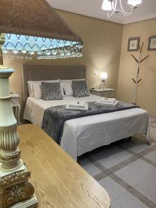 Cama o camas de una habitación en Casa de Huéspedes Vecinodecerbantes