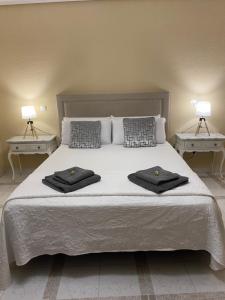 Cama o camas de una habitación en Casa de Huéspedes Vecinodecerbantes