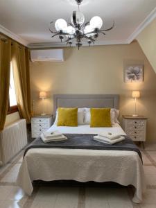 Cama o camas de una habitación en Casa de Huéspedes Vecinodecerbantes