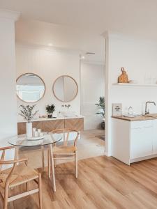 a kitchen and dining room with a table and chairs at Harrington Guest Suite in Harrington