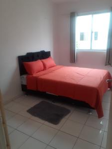 Ένα ή περισσότερα κρεβάτια σε δωμάτιο στο Apartamento próximo as praias