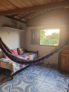 Ένα ή περισσότερα κρεβάτια σε δωμάτιο στο Hospedagem Casinha do Solar