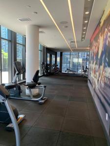 a gym with cardio equipment in a building at Beautiful 1Bd Entertainment disrtrict. in Toronto