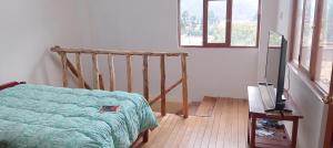 מיטה או מיטות בחדר ב-Casita de campo
