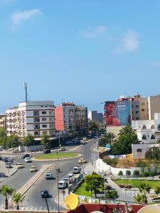 a view of a city with cars on a street at Milz house in Salé