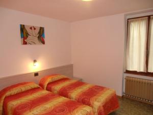 Posteľ alebo postele v izbe v ubytovaní Casa Ambra