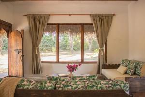 Giường trong phòng chung tại SAVANNA ORINOQUÍA LODGE