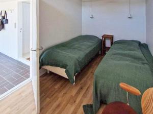 Postel nebo postele na pokoji v ubytování Holiday home Blokhus XLVII