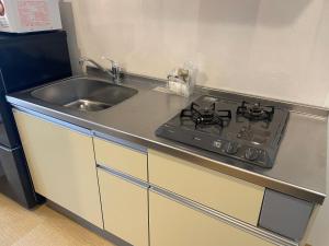 Cucina o angolo cottura di BiBi Hotel Cosmos Shintoshin