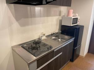 Cucina o angolo cottura di BiBi Hotel Cosmos Shintoshin