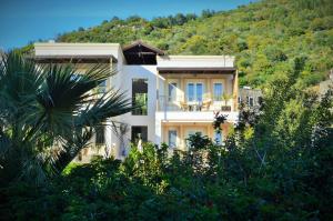 a house on the side of a mountain at The Aegean Gate Hotel in Bodrum City