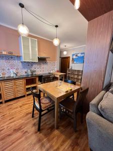 a kitchen and dining room with a table and chairs at Location, locaton, location! in Ulaanbaatar