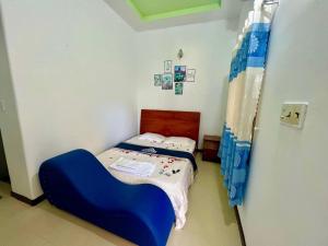 Ένα ή περισσότερα κρεβάτια σε δωμάτιο στο Huyền Anh Motel Cam Ranh