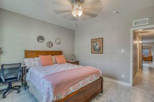 a bedroom with a bed and a desk and a ceiling fan at Close to Everything Cozy Duplex B in Downtown, UTEP, Hospitals in El Paso