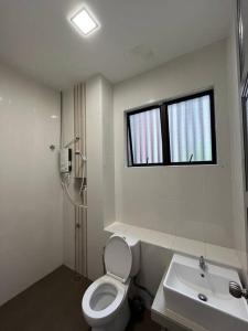 a bathroom with a toilet and a sink and a window at 4B12B Bar 5 min City Center-no karaoke in Ipoh +21 photos