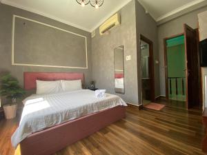 Postel nebo postele na pokoji v ubytování Dylan Hotel