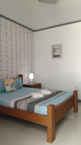 Säng eller sängar i ett rum på ELEN INN - Malapascua Island Air-conditioned Room2