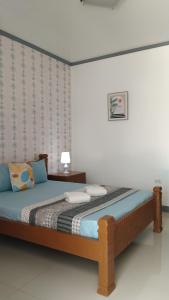 A bed or beds in a room at ELEN INN - Malapascua Island Air-conditioned Room2