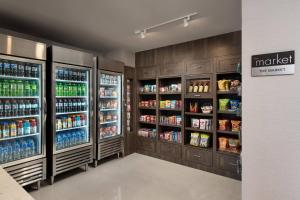 a grocery store aisle with many bottles of soda at Residence Inn by Marriott Oklahoma City Norman in Norman