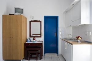 A kitchen or kitchenette at Ancient Thera Studios