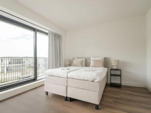 Postel nebo postele na pokoji v ubytování Cosy, modern family villa up to 6p in Flevoland in a wonderful environment