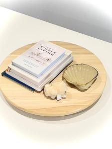 a plate with books and a bowl of food at Salty's Island Shack in Dunwich