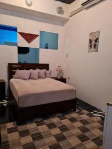 Postel nebo postele na pokoji v ubytování Sky Beach Rooms