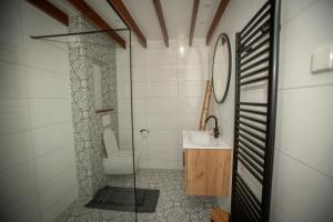 a bathroom with a sink and a toilet at Bed & Breakfast Bakker Meijer in Heemskerk