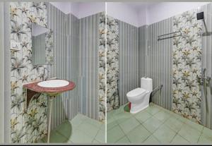 a bathroom with a sink and a toilet at HOTEL AMAN in Allahābād +13 photos