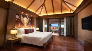 a bedroom with a large white bed and a television at Amari Vogue Krabi in Tab Kaek Beach +37 photos