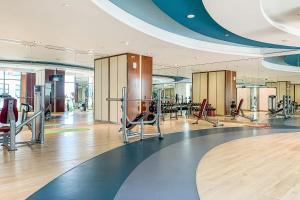 a gym with exercise equipment in a building at Frank Porter - Damac Celestia in Dubai
