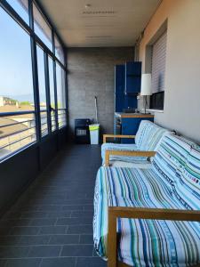 two beds in a room with a view of the ocean at Dannunziano Aparthotel in Chieti