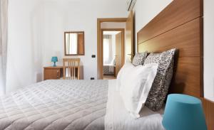 A bed or beds in a room at Residence Del Sole