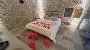 a bedroom with a bed with a sign that says nothing more at Luxury Suite Alfieri in Martina Franca